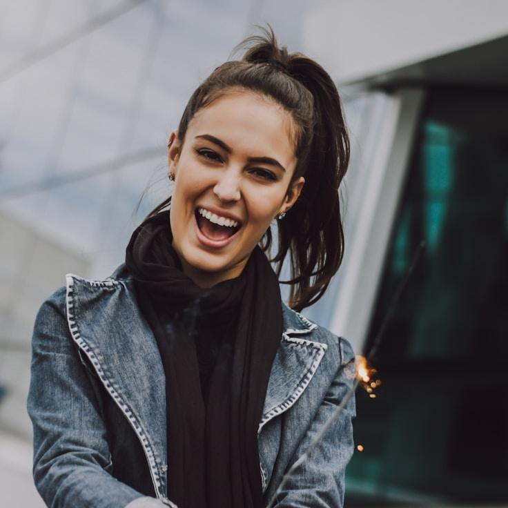 Kaveri Mehta, Lead Design Curator at Berry Hill Crate, reviewing corporate floral arrangements